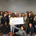 Students of Project LEAH pose with the oversize Project Innovation grant check.